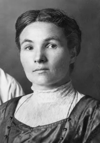 Black-and-white portrait of Anna (Annie) Jepson, a young woman with dark hair parted in the middle, wearing a high-collared blouse