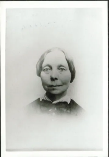 Faded black-and-white portrait of Helen Wilson Davis, an older woman with her hair parted in the middle