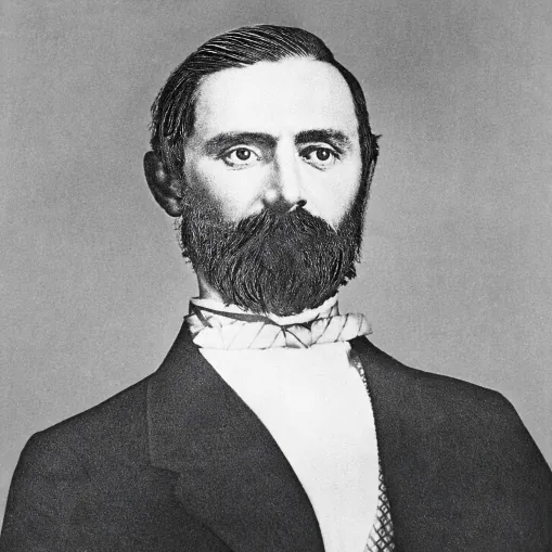 Black-and-white portrait of Fred Stolt, a bearded man in a dark coat and white shirt